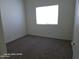 Bedroom with carpet and a bright window at 20641 N 110Th Ave, Peoria, AZ 85373