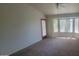 Cozy carpeted bedroom boasts natural light from the bay window at 20641 N 110Th Ave, Peoria, AZ 85373
