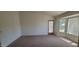 Bedroom features carpet, a bay window, and access to the outdoors at 20641 N 110Th Ave, Peoria, AZ 85373