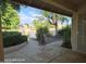 Inviting entrance with flagstone walkway leads to the door of a waterfront property and lush landscaping at 20641 N 110Th Ave, Peoria, AZ 85373