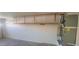 Clean and organized garage space with overhead storage rack and utility connections for convenience at 20641 N 110Th Ave, Peoria, AZ 85373