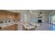 Open-concept kitchen with breakfast bar area connects to a spacious living room at 20641 N 110Th Ave, Peoria, AZ 85373