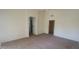 Bright living room with neutral carpeting and arched doorway to the rest of the house at 20641 N 110Th Ave, Peoria, AZ 85373