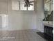 Open-concept living room featuring a fireplace and views of the upper level at 20641 N 110Th Ave, Peoria, AZ 85373