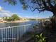 Panoramic view of the pond showcasing the serene waterfront living and neighborhood landscaping at 20641 N 110Th Ave, Peoria, AZ 85373