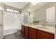 Bright bathroom featuring a double sink vanity, tub, and shower with modern fixtures at 21039 E Avenida Del Valle --, Queen Creek, AZ 85142