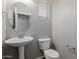 Cozy powder room showcasing a pedestal sink, standard toilet, and neutral wall color at 21039 E Avenida Del Valle --, Queen Creek, AZ 85142