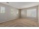 Spacious bedroom with carpet floors, large windows offering plenty of natural light, and neutral walls at 21039 E Avenida Del Valle --, Queen Creek, AZ 85142