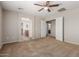 Spacious bedroom featuring a ceiling fan and neutral-toned walls, adjacent to the bathroom at 21039 E Avenida Del Valle --, Queen Creek, AZ 85142
