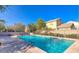 Sparkling community pool and jacuzzi with lounge chairs and manicured landscaping at 21039 E Avenida Del Valle --, Queen Creek, AZ 85142