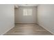 Clean and simple room with wood floors, offering a blank canvas for personalization at 21039 E Avenida Del Valle --, Queen Creek, AZ 85142