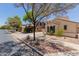 A view of the home from the street with desert landscaping at 21039 E Avenida Del Valle --, Queen Creek, AZ 85142
