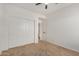 Simple bedroom features neutral carpet, closet and a doorway to the hall at 2226 N Gentry --, Mesa, AZ 85213