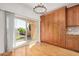 Dining area features wood floors, backyard view, and wood cabinets for storage at 2226 N Gentry --, Mesa, AZ 85213