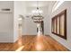 Bright dining room features hardwood floors, stylish chandelier, shuttered windows and high ceilings at 2226 N Gentry --, Mesa, AZ 85213