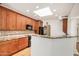 Kitchen features granite counter, wood cabinets, and a breakfast bar at 2226 N Gentry --, Mesa, AZ 85213