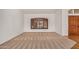 Spacious living room featuring carpeted floors and plantation shutters at 2226 N Gentry --, Mesa, AZ 85213