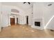 Open-concept living room features tile flooring, fireplace, and arched entryway at 2226 N Gentry --, Mesa, AZ 85213