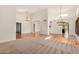 Bright living room with hardwood floors, high ceilings, and elegant chandeliers at 2226 N Gentry --, Mesa, AZ 85213