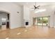 Living room boasts tile floors, fireplace, and seamless access to the backyard at 2226 N Gentry --, Mesa, AZ 85213
