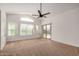Spacious main bedroom featuring a ceiling fan and backyard views at 2226 N Gentry --, Mesa, AZ 85213