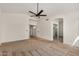 Spacious main bedroom featuring a ceiling fan and access to the bathroom at 2226 N Gentry --, Mesa, AZ 85213