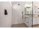 Modern shower with black fixtures and a niche for products, complemented by a sleek glass partition at 2226 N Gentry --, Mesa, AZ 85213