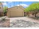 Inviting single-story home with a two-car garage, well-maintained landscaping, and a welcoming entrance at 23787 W Yavapai St, Buckeye, AZ 85326