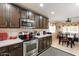 A view of the kitchen and dining area, featuring modern appliances and ample cabinet space at 23787 W Yavapai St, Buckeye, AZ 85326