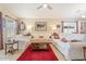 Bright living room featuring tile floors, comfortable seating, and large windows for natural light at 23787 W Yavapai St, Buckeye, AZ 85326