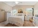 A bright main bedroom with tasteful furnishings, a ceiling fan and ample natural light at 23787 W Yavapai St, Buckeye, AZ 85326