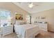 A serene main bedroom featuring a large bed, soft lighting, and elegant decor at 23787 W Yavapai St, Buckeye, AZ 85326