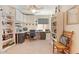 A functional home office with built-in shelves, ample storage, and a comfortable workspace at 23787 W Yavapai St, Buckeye, AZ 85326