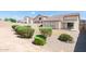 Large backyard featuring gravel, shrubbery, and a block wall that provides a private outdoor space at 2698 E Denim Trl, San Tan Valley, AZ 85143