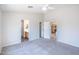 Spacious bedroom features a ceiling fan, two closets, and ensuite bathroom and kitchen access at 2698 E Denim Trl, San Tan Valley, AZ 85143