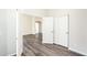 Bright room has closet with folding doors and an open doorway to another room at 2698 E Denim Trl, San Tan Valley, AZ 85143
