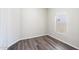 Well-lit bedroom features durable wood floors, window for natural light, and multiple electrical outlets at 2698 E Denim Trl, San Tan Valley, AZ 85143