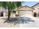 Inviting home featuring desert landscaping, attached two-car garage, and neutral exterior paint at 2698 E Denim Trl, San Tan Valley, AZ 85143