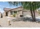 Attractive home with a two-car garage, desert landscaping, and a well-maintained front yard at 2698 E Denim Trl, San Tan Valley, AZ 85143