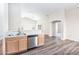 Bright kitchen features stainless steel dishwasher, ample wood cabinetry, and a sleek marble-look countertop at 2698 E Denim Trl, San Tan Valley, AZ 85143