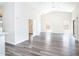Bright living room with vaulted ceilings, modern gray flooring, and plenty of natural light at 2698 E Denim Trl, San Tan Valley, AZ 85143