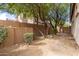 Well-kept backyard featuring mature trees, lush greenery, and a peaceful ambiance, ideal for relaxation at 3055 N Red Mtn # 77, Mesa, AZ 85207