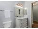 Bright bathroom with white vanity, decorative mirror, and light blue walls at 3055 N Red Mtn # 77, Mesa, AZ 85207