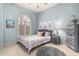 Stylish bedroom featuring an arched window with shutters and decoratively painted blue walls at 3055 N Red Mtn # 77, Mesa, AZ 85207