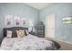Stylish bedroom featuring decoratively painted blue walls and views to closet and ensuite at 3055 N Red Mtn # 77, Mesa, AZ 85207