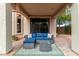 Charming covered patio area with stylish outdoor furniture, great for entertaining at 3055 N Red Mtn # 77, Mesa, AZ 85207