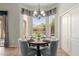 Cozy breakfast nook with a bay window, stylish chandelier, and comfortable seating at 3055 N Red Mtn # 77, Mesa, AZ 85207