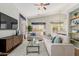 Bright living room featuring vaulted ceilings, comfortable seating, and large windows at 3055 N Red Mtn # 77, Mesa, AZ 85207