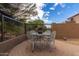 Charming outdoor patio with a decorative table and chairs, perfect for al fresco dining at 3055 N Red Mtn # 77, Mesa, AZ 85207