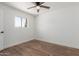 Cozy bedroom featuring updated floors and natural light from a window at 350 N 88Th St, Mesa, AZ 85207